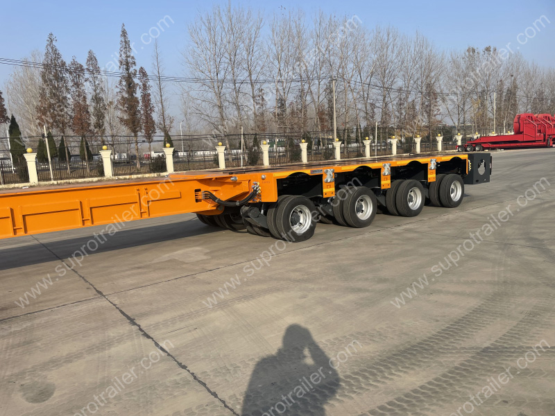 extendable spacer with hydraulic modular trailer