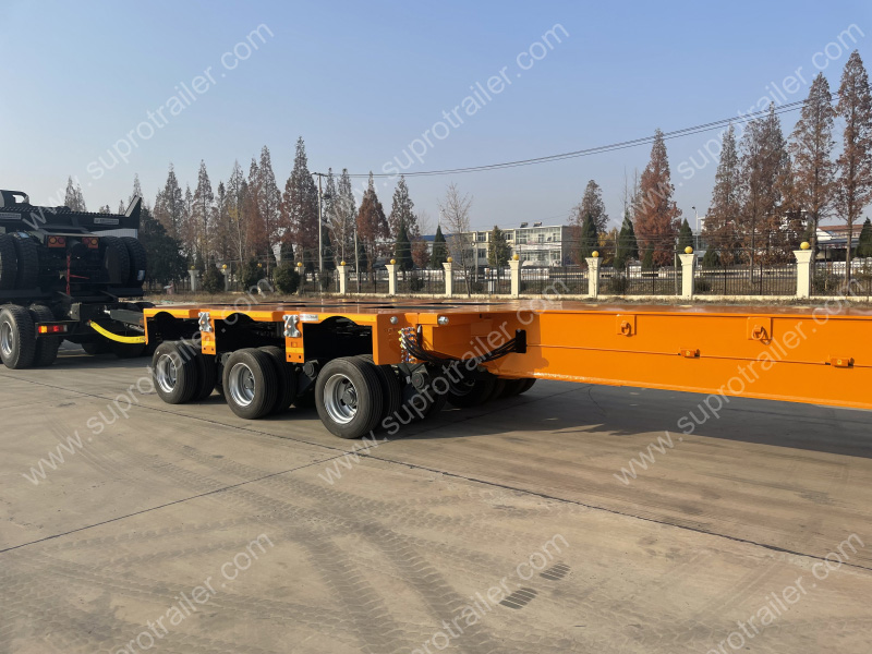 extendable spacer with hydraulic modular trailer