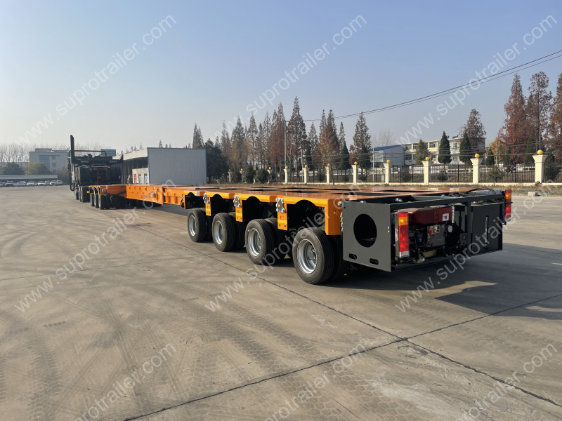 extendable spacer with hydraulic modular trailer